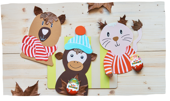 Handmade animal crafts with Kinder Überraschung eggs - bear, monkey, and cat with autumn leaves